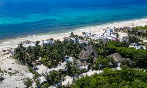 Aerial view of Hacienda del Secreto's beachfront villas and pools on Playa del Secreto