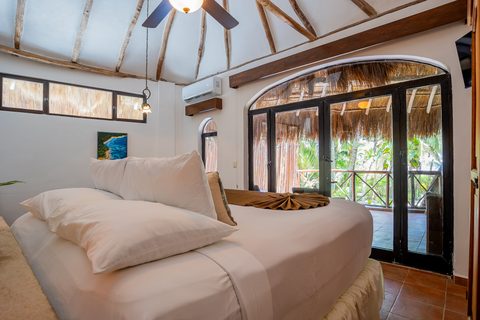 The Honeymoon and Family palapa suites at Hacienda del Secreto, above Palapa Papa Jack