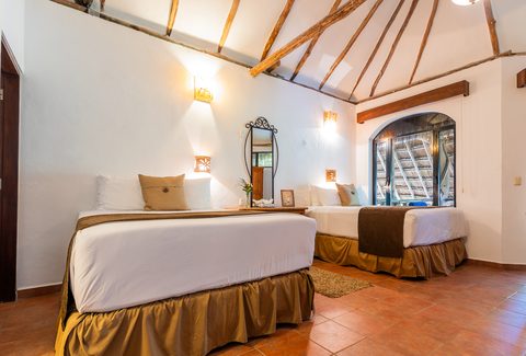 The Honeymoon and Family palapa suites at Hacienda del Secreto, above Palapa Papa Jack