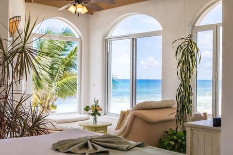 Villa Sarita at Hacienda del Secreto, a turquoise-and-gold beachfront villa on Playa del Secreto