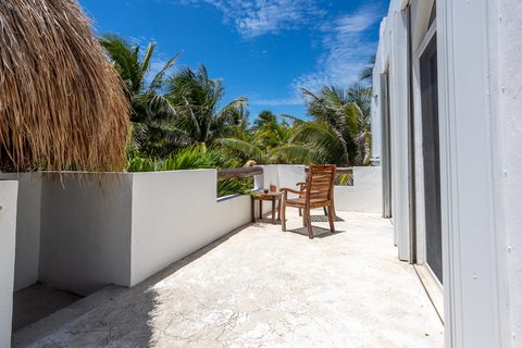 Villa Sarita at Hacienda del Secreto, a turquoise-and-gold beachfront villa on Playa del Secreto