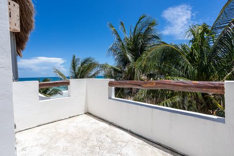 Villa Sarita at Hacienda del Secreto, a turquoise-and-gold beachfront villa on Playa del Secreto