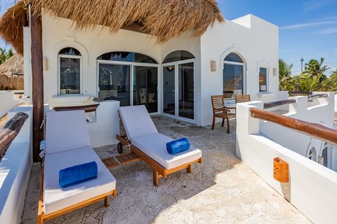 Villa Sarita at Hacienda del Secreto, a turquoise-and-gold beachfront villa on Playa del Secreto