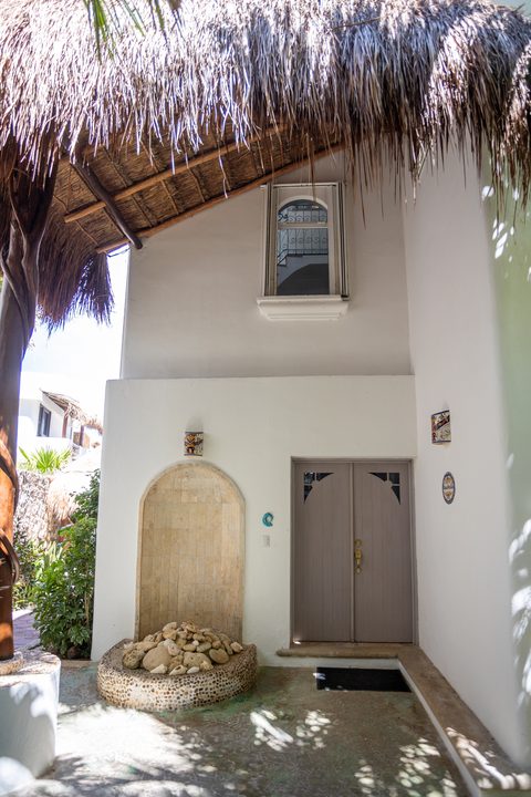 Villa Sarita at Hacienda del Secreto, a turquoise-and-gold beachfront villa on Playa del Secreto