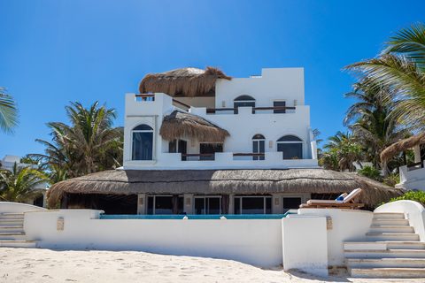 Villa Sarita at Hacienda del Secreto, a turquoise-and-gold beachfront villa on Playa del Secreto