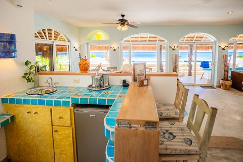 Villa Sarita at Hacienda del Secreto, a turquoise-and-gold beachfront villa on Playa del Secreto