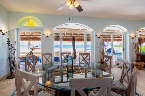Villa Sarita at Hacienda del Secreto, a turquoise-and-gold beachfront villa on Playa del Secreto