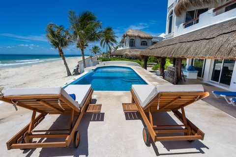 Villa Sarita at Hacienda del Secreto, a turquoise-and-gold beachfront villa on Playa del Secreto
