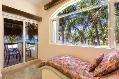 Villa Sarita at Hacienda del Secreto, a turquoise-and-gold beachfront villa on Playa del Secreto
