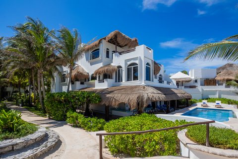 Villa Sarita at Hacienda del Secreto, a turquoise-and-gold beachfront villa on Playa del Secreto