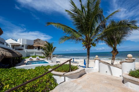 Villa Sarita at Hacienda del Secreto, a turquoise-and-gold beachfront villa on Playa del Secreto