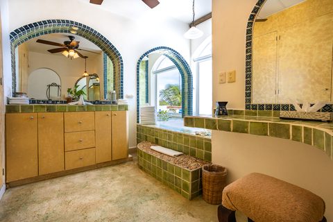 Villa Sarita at Hacienda del Secreto, a turquoise-and-gold beachfront villa on Playa del Secreto