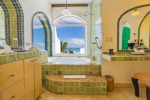 Villa Sarita at Hacienda del Secreto, a turquoise-and-gold beachfront villa on Playa del Secreto