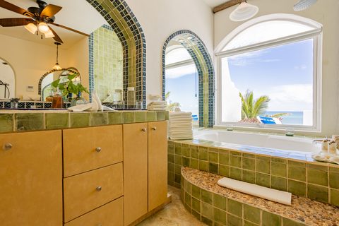 Villa Sarita at Hacienda del Secreto, a turquoise-and-gold beachfront villa on Playa del Secreto