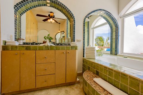 Villa Sarita at Hacienda del Secreto, a turquoise-and-gold beachfront villa on Playa del Secreto