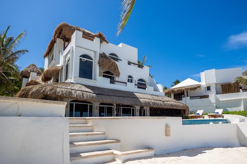 Villa Sarita at Hacienda del Secreto, a turquoise-and-gold beachfront villa on Playa del Secreto
